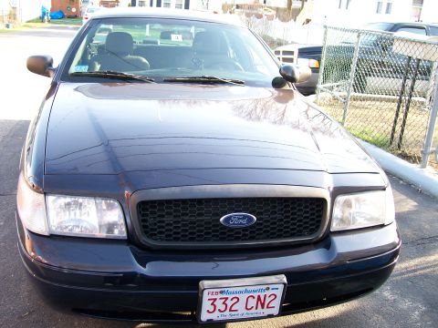 2007 Ford Crown Victoria - The front grille and headlights of a Ford Crown Victoria are visible, along with a Massachusetts license plate.