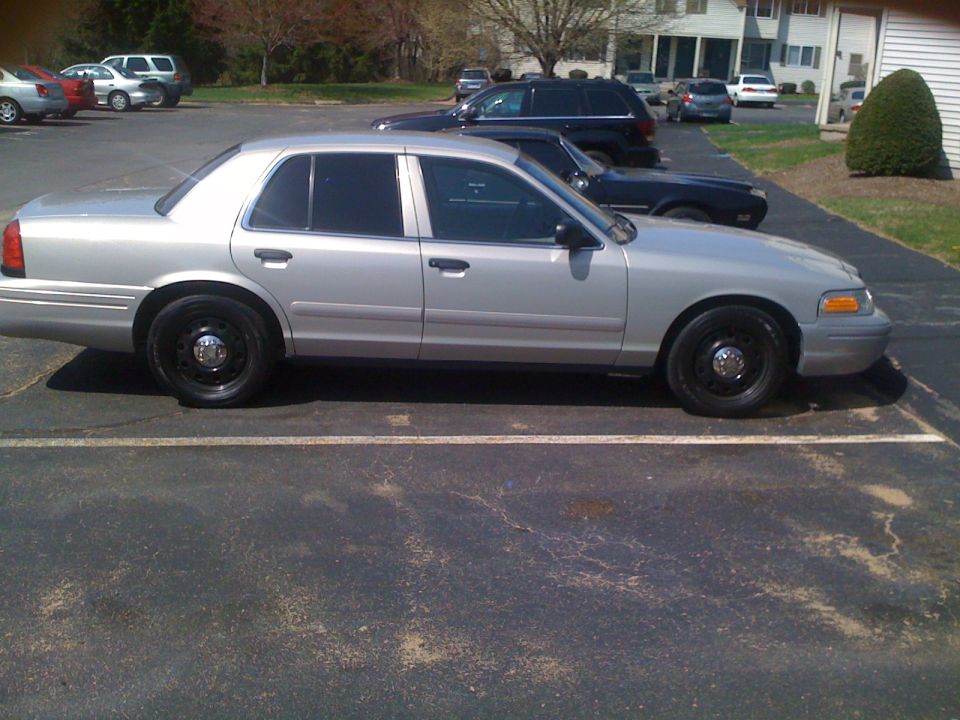 Silver 2009 Ford Crown Victoria sedan, side view