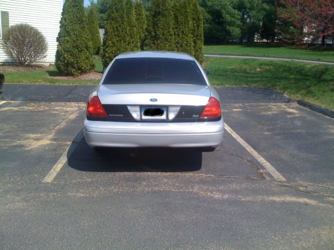 2009 Ford Crown Victoria - Rear view of a silver 2009 Ford Crown Victoria parked in an outdoor lot.
