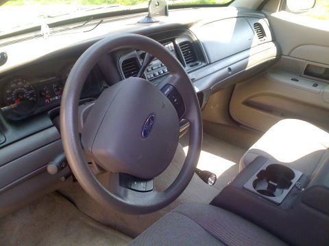2009 Ford Crown Victoria - Interior view of a 2009 Ford Crown Victoria, showing the dashboard, steering wheel, and center console.