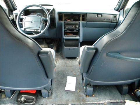 1993 Dodge Grand Caravan - Interior view of a 1993 Dodge Grand Caravan, highlighting the dashboard and seating.
