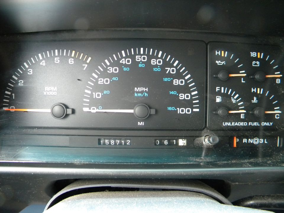 Speedometer, tachometer, fuel gauge, temp gauge, and odometer reading 158712