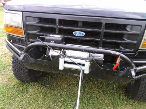 1994 Ford Bronco - The grille and headlight design suggest this Ford truck is from the early to mid-1990s, not a 1994 Bronco.