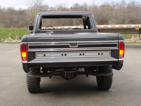 1979 Ford F-250 - This 1979 Ford F-250 pickup truck is shown from the rear, the prominent 'FORD' lettering across the tailgate.