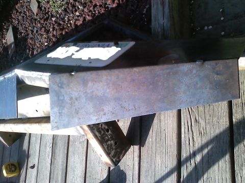 1990 Ford Bronco - A close-up view of a fabricated brushguard, a license plate and visible welding marks.