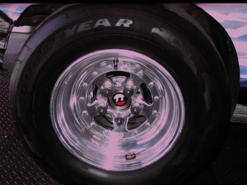 1992 Ford Mustang - A close-up view of a polished Weld racing wheel and a Goodyear tire, highlighting the custom modifications.