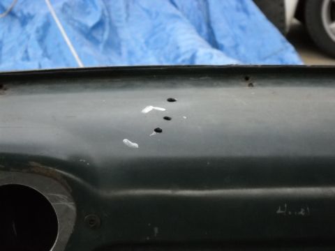 1954 Ford F-100 - Detail of a vehicle's interior dashboard showing drilled holes and paint marks.