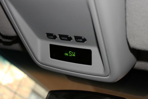 2003 Ford Crown Victoria - Interior view of a vehicle's overhead console with a digital display and control buttons.