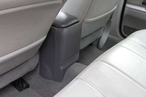 2003 Ford Crown Victoria - Rear interior view of a 2003 Ford Crown Victoria, highlighting the seats and center console.