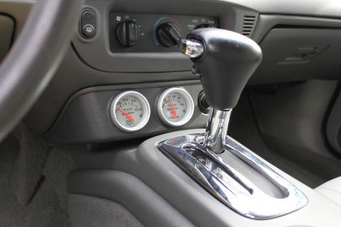 2003 Ford Crown Victoria - Aftermarket gauges are installed in the center console of this vehicle, likely modified, vehicle.