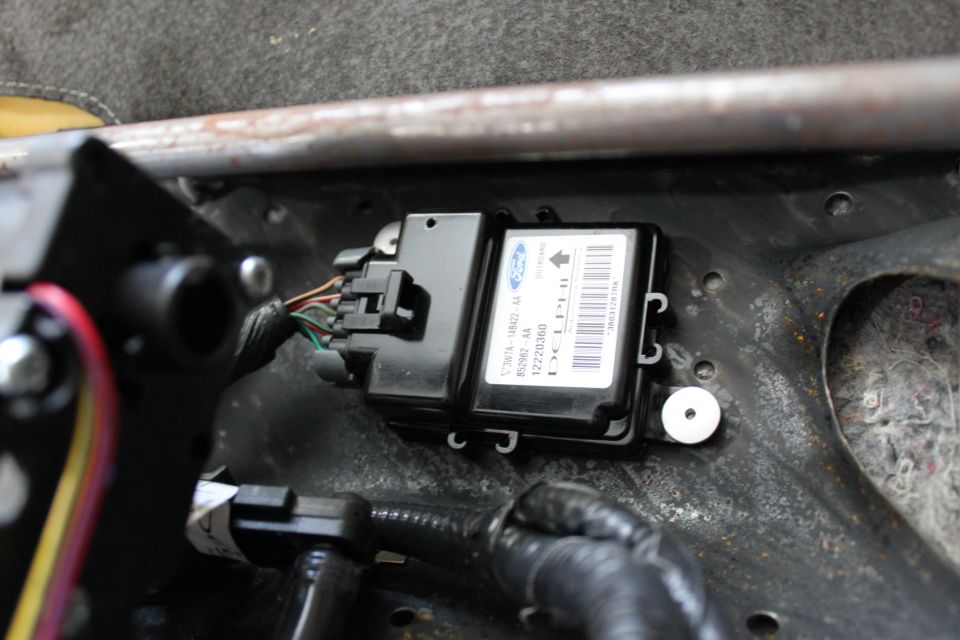this is the problem source, the 2003 LX restraint control module. drill out the two rivets and remove the module.