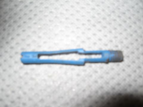 1994 Ford Bronco - A blue plastic component, possibly a clip or fastener, is shown against a textured background.