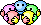 1990 Ford Bronco - A group of pixelated smiley faces in various pastel colors are arranged in a circular pattern.
