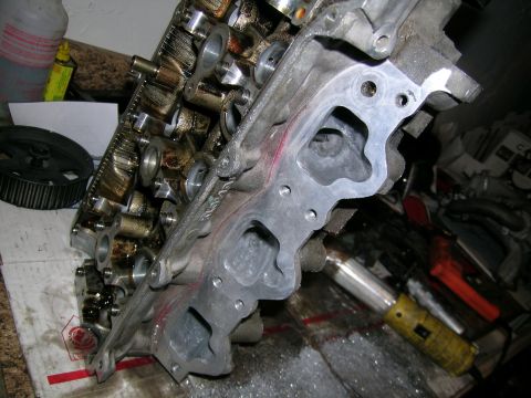 1995 Ford Probe - Close-up view of an engine cylinder head, showing the intake ports and valve train components.