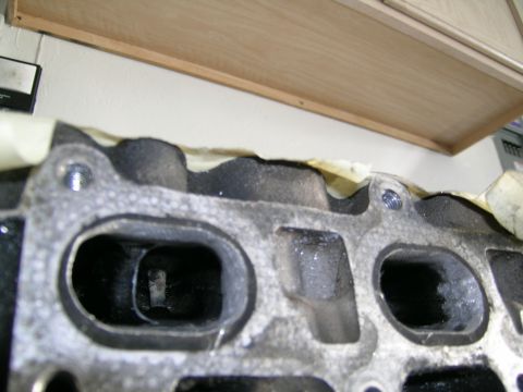 1995 Ford Probe - Close-up of an engine cylinder head, likely undergoing maintenance or modification.