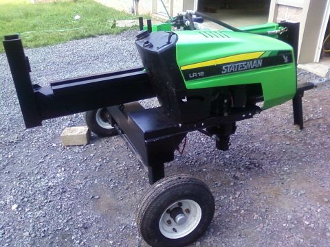 1978 Ford Bronco - A green log splitter with a black frame and wheels is shown outdoors. The side displays 'STATESMAN LR 12'.