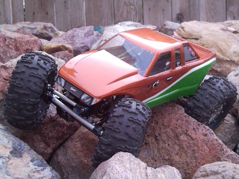 1989 Ford Bronco - This remote-controlled truck is navigating a rocky terrain, its off-road capabilities.