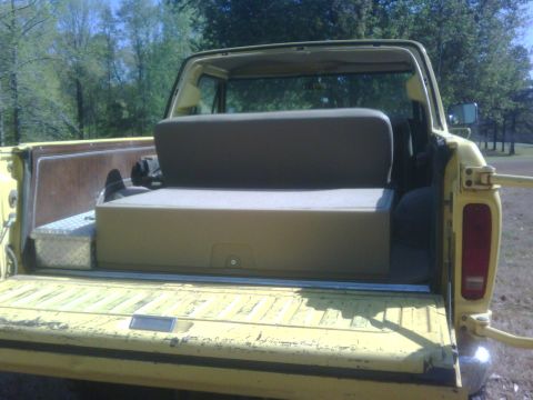 1978 Ford Bronco - Rear view of a 1978 Ford Bronco showing the interior storage and seating.