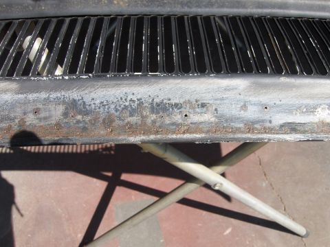 1980 Chevrolet Camaro - Close-up of a weathered car grille, revealing signs of rust and wear on its lower section.
