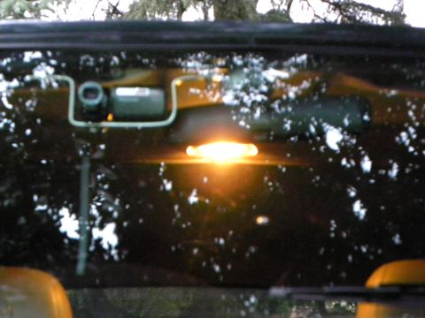 1995 Ford Bronco - View from inside a vehicle, showing the dome light and a camera.