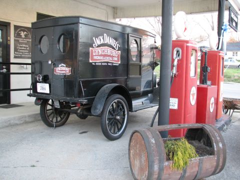 2006 Victory Kingpin - This vintage Jack Daniel's truck is parked at a gas station with old-fashioned pumps and a barrel planter.
