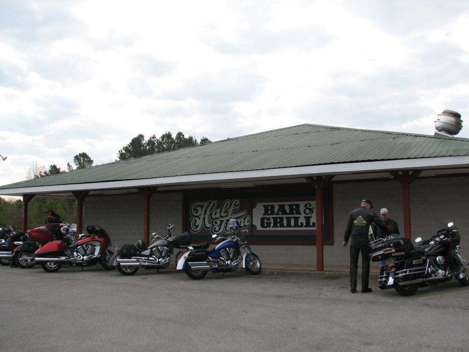 motorcycles parked in front of Half Time Bar & Grill