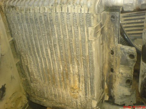 1998 Ford Crown Victoria - Dirty radiator or condenser fins showing signs of wear and debris accumulation.
