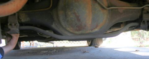 1976 Ford Ranchero - A close-up view of the rear differential and suspension system of a vehicle.