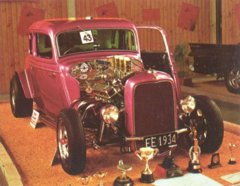 1969 Lincoln Continental - This custom hot rod features a prominent grille, exposed engine, and a license plate indicating the year 1934.