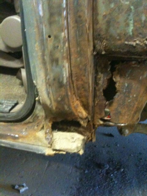 1993 Ford Bronco - Significant rust damage is visible on the door frame, with a large section missing.