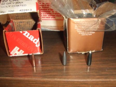 1996 Ford Bronco - Ammunition bullets and their packaging are displayed on a wooden table.