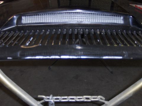 1980 Chevrolet Camaro - Close-up of a car's front grille, showing its distinctive horizontal bar design and upper mesh vent.