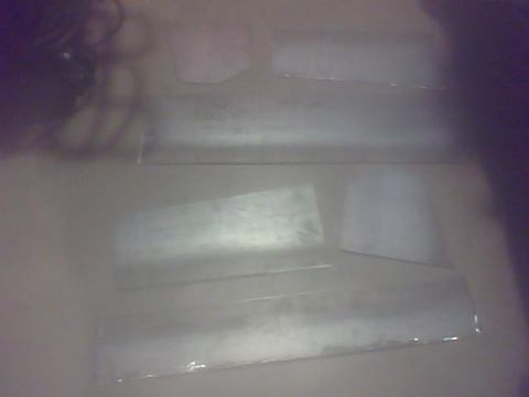 2000 Dodge 1500 - Several flat pieces of sheet metal are laid out, possibly for a vehicle repair or fabrication project, with a Supermotors.net watermark vis…