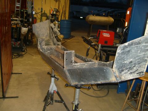 2000 Dodge 1500 - Custom metal bumper fabrication in progress, with welding equipment nearby.