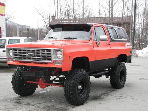 1990 Chevrolet Suburban - This lifted SUV features a two-tone paint scheme and aggressive off-road tires.