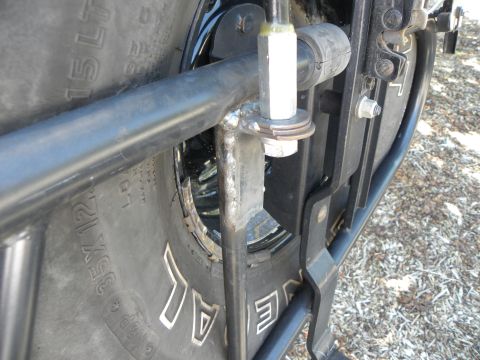 1995 Ford Bronco - Detail of a spare tire mount and tire, showing tire size information on the sidewall.