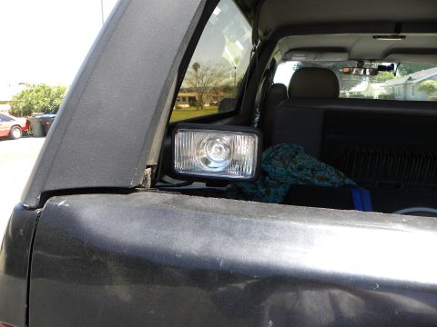 1995 Ford Bronco - An auxiliary light is installed inside the cargo area of the vehicle, near the rear window.