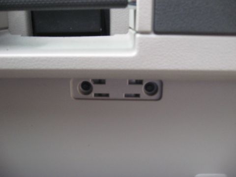 2008 Ford F-250 - Close-up of the interior power outlets, showing two distinct sockets.