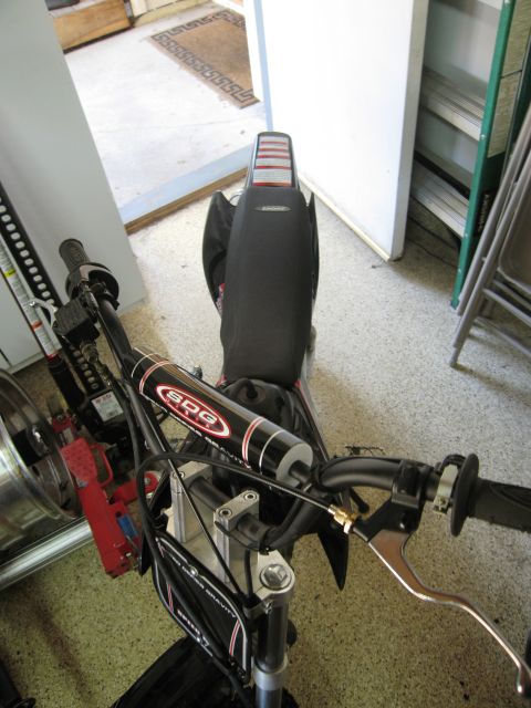 1986 Ford Bronco - The SDG pit bike is shown from a top-down perspective, focusing on the handlebars and seat area.