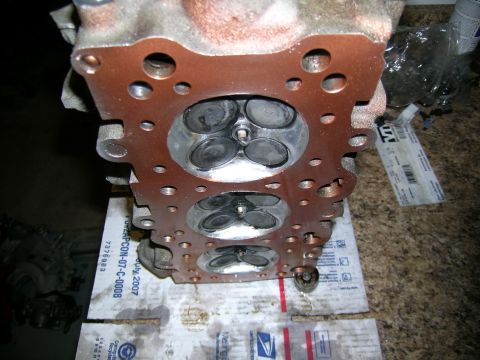 1995 Ford Probe - Close-up of an engine cylinder head, showing multiple valves and combustion chambers.