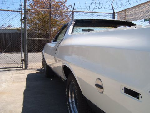 1973 Ford Ranchero - This white 1972 Ford Ranchero shows significant body damage and missing parts.