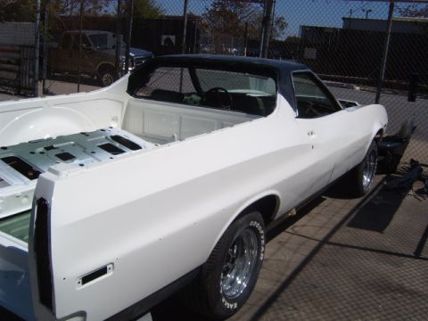 1973 Ford Ranchero - This 1972 Ford Ranchero is in the process of being restored, showing its white exterior and black top.