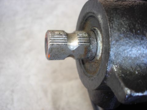 1992 Ford Bronco - A close-up view of a splined shaft and its housing, showing wear and a small orange mark.