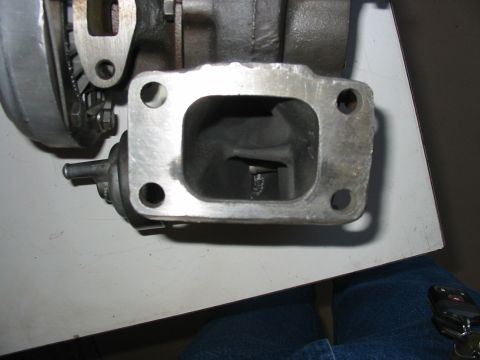 1993 Ford Taurus - Close-up of a turbocharger wastegate actuator, showing the mounting flange and internal components.