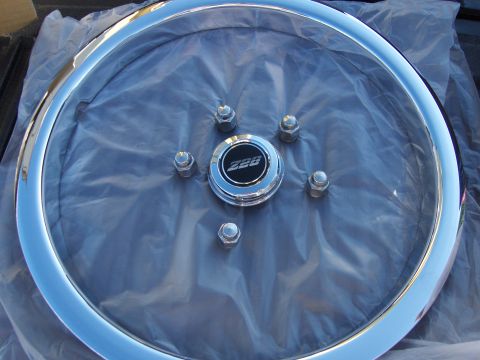 1980 Chevrolet Camaro - A close-up view of a chrome wheel and its center cap, which displays the number "228".