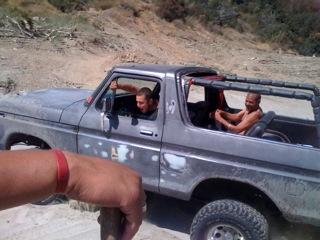 1978 Ford Bronco - Two men in a gray 1978 Ford Bronco navigate an off-road trail.