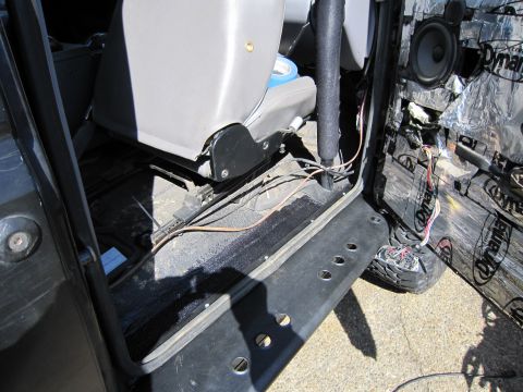 1996 Ford Bronco - Interior view of a 1996 Ford Bronco, highlighting the removed door panel and seat area.