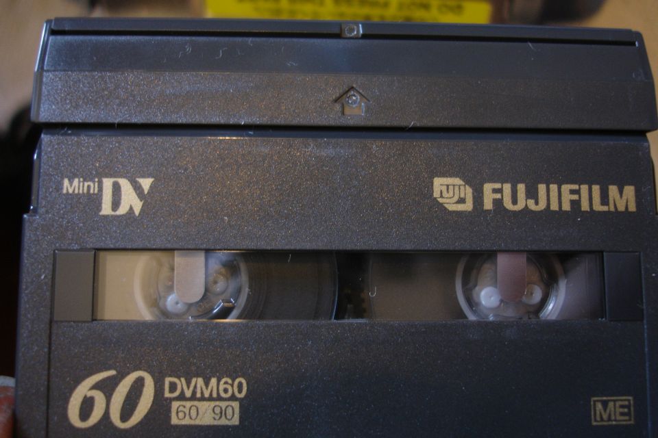 Mini DV tape with Fujifilm branding and DVM60 label