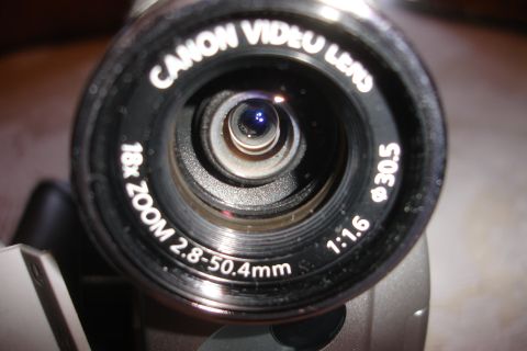 1993 Ford Taurus - The lens has markings for zoom, aperture, and filter thread size.