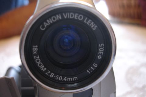 1993 Ford Taurus - Close-up of a camcorder lens showing brand and zoom specifications.